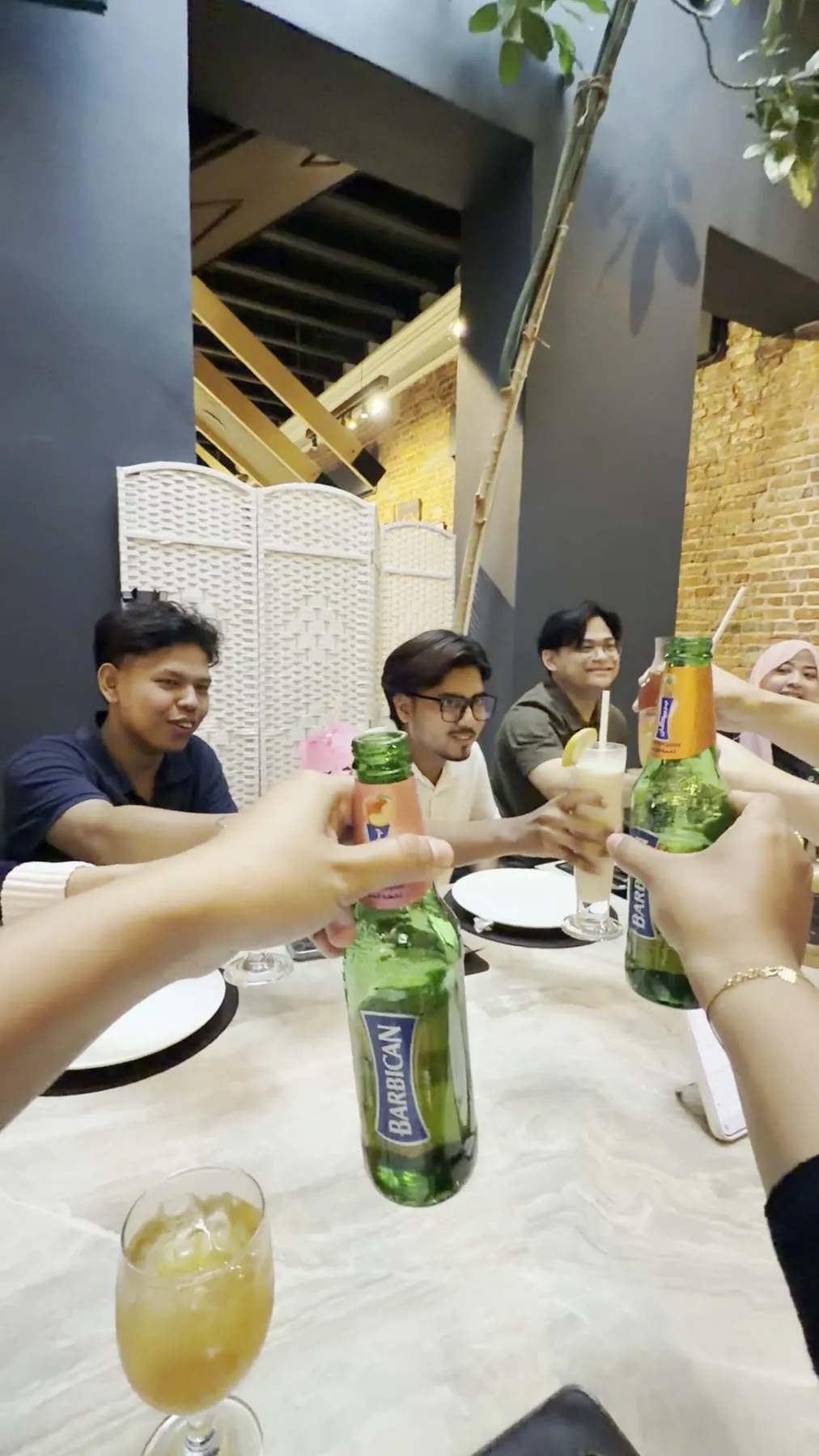 Team raising drinks at a company dinner