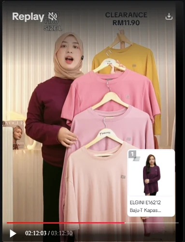 Techwide host showing a rack of T-shirts on TikTok Live